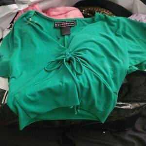 Polly Esther Green slightly  adjustable mid section in size Large